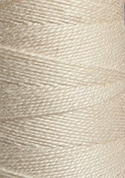 Close-up of a spool of Circulo 10/2 Looma Circulo Mercerized Pearl Cotton Yarn in beige or off-white, highlighting the texture and tightly wound fibers in a diagonal pattern on the large cone.