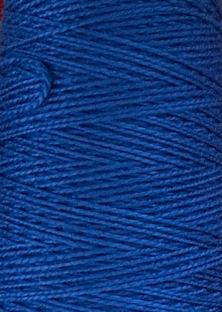 Close-up of a spool of 10/2 Looma Circulo Mercerized Pearl Cotton Yarn in blue, featuring tightly wound threads with a soft texture and rich, vibrant blue color throughout—ideal for use as pearl cotton weaving yarn from Circulo.