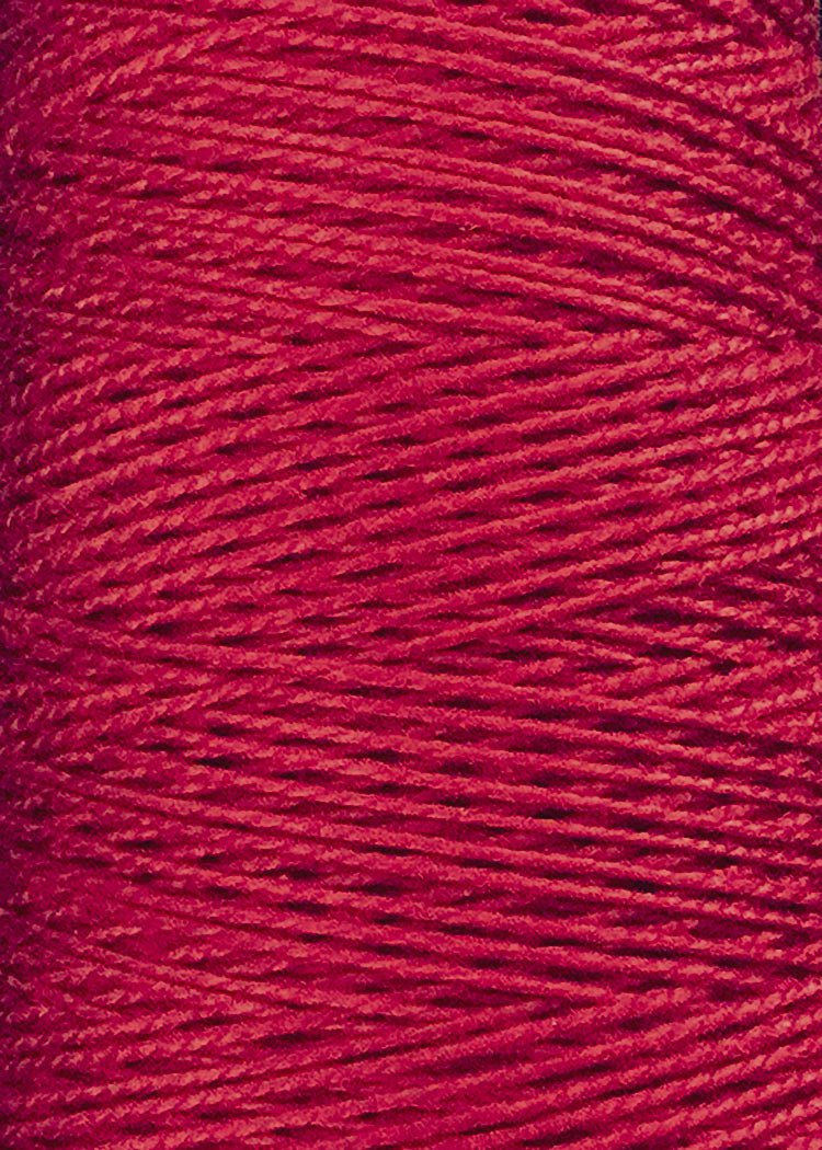 Close-up of a spool of Circulo 10/2 Looma Mercerized Pearl Cotton Yarn in red, showing tightly wound, shiny fibers with a slightly textured surface on a large cone.