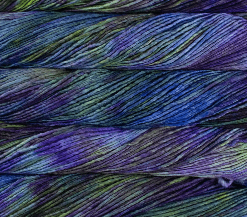 Three skeins of Malabrigo Merino Worsted Wool Yarn in a kettle-dyed, variegated pattern of deep purple, teal, and lime green.