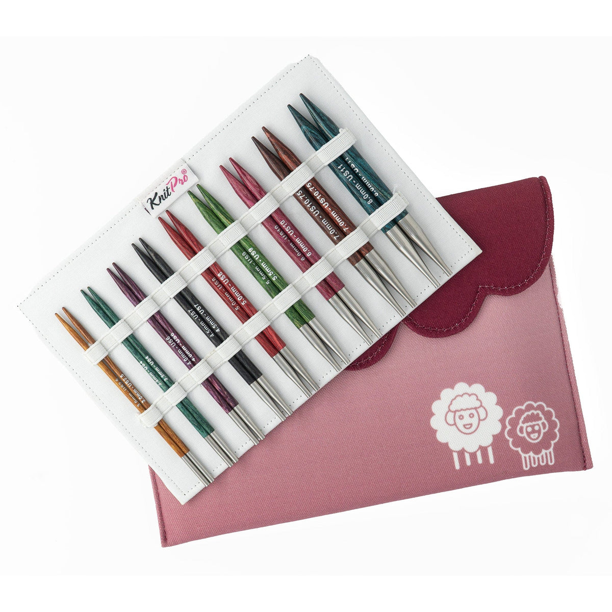 A set of colorful Accessories Unlimited Knit Pro (Knitters Pride) Dreamz Interchangeable Circular Knitting Needle tips is displayed in a white holder marked KnitPro, beside a pink case with two cartoon sheep.