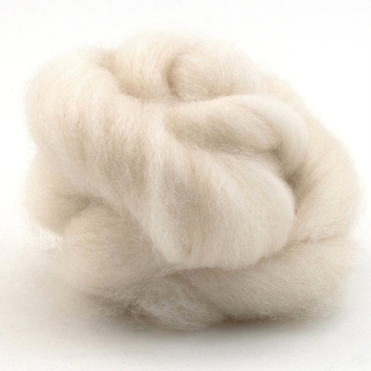 A fluffy, rounded mound of off-white Punta Wool Top Fiber, ideal for spinning or felting.