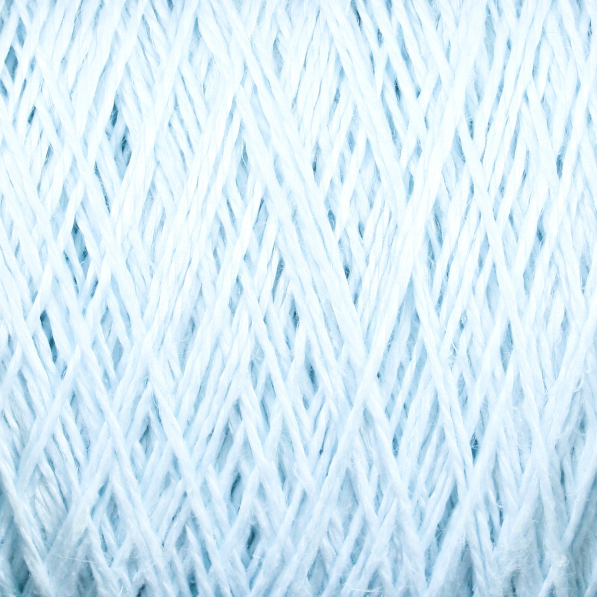 Close-up of Halcyon Yarn's Newport 16/2 Linen Yarn Mini-cone strands tightly coiled, showing a crisscross pattern, soft texture, and visible fibers.