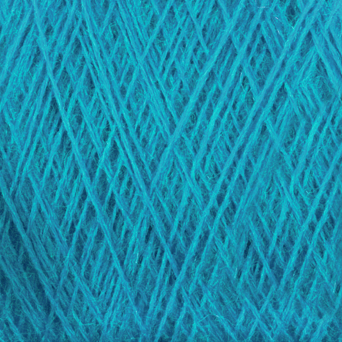Close-up of JaggerSpun Superfine Merino 2/18 Yarn (Mini-cone) by Jagger Brothers, Inc.—vivid blue superfine merino wool with soft, textured fibers in crisscrossing layers, ideal for hand knitting projects.