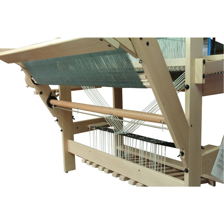 A close-up side view of a Louet David loom with teal threads highlights the Louët Sliding Beater Conversion Kit by Louet Inc., showcasing its frame, innovative sliding beater system, weaving mechanism, and visible foot pedals underneath.
