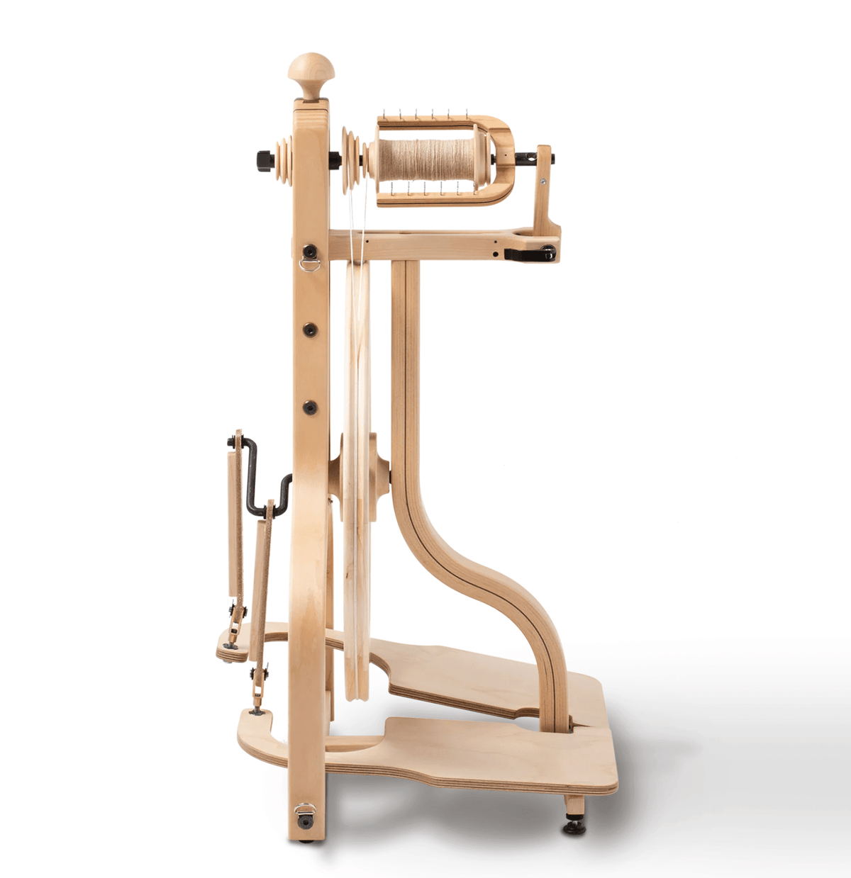 The Schacht Matchless Spinning Wheel, Double Treadle by Schacht Spindle Co. features hardwood construction, a large drive wheel, flyer, and a thread-wound bobbin. Shown from the side on a white background.