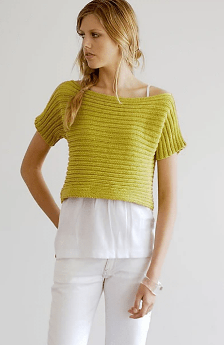 A woman wears a chartreuse, short-sleeved Sideways Ribbed Top Pattern, by Jo Sharp (print only) over a white shirt and white pants.