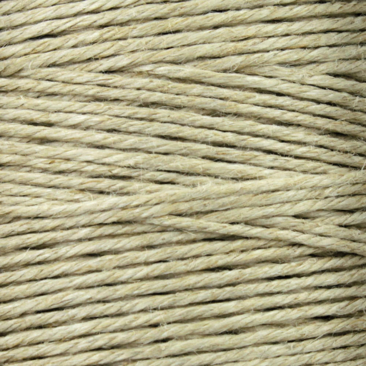 Close-up of Soft Finish Linen Warps by Kingfisher Yarn & Fibre, featuring neat rows of beige twine and visible fibers—perfect for tapestry weaving or as linen warps in traditional Scandinavian rugs.
