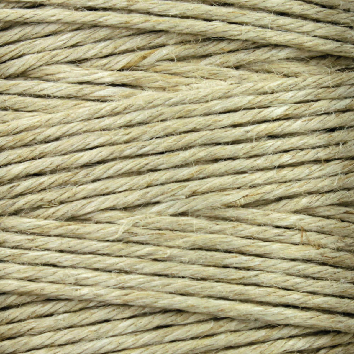 Close-up of Kingfisher Yarn & Fibre’s Soft Finish Linen Warps—beige twine with visible fiber texture and subtle thickness variations, tightly wound strands ideal for tapestry weaving.