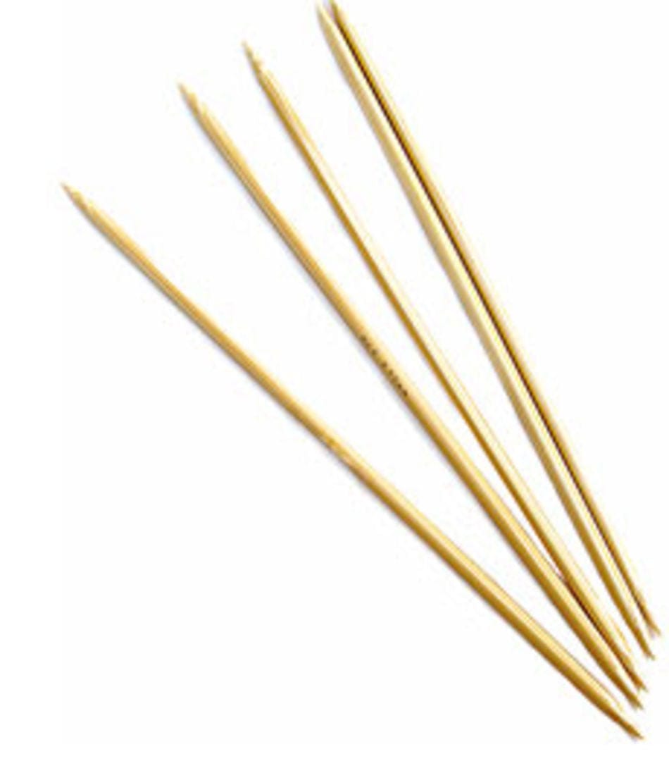 Five N. Jefferson Double-Point Bamboo Knitting Needles, 8", with a smooth polished finish, are arranged on a white background, their lightweight pointed ends facing in various directions.