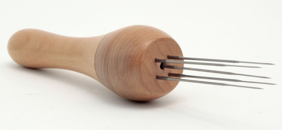 The Ashford Needle Felting Punch Tool by Ashford Handicrafts Limited features a wooden handle and five evenly spaced metal prongs, resembling multi-needle felting holders, shown on a white background.