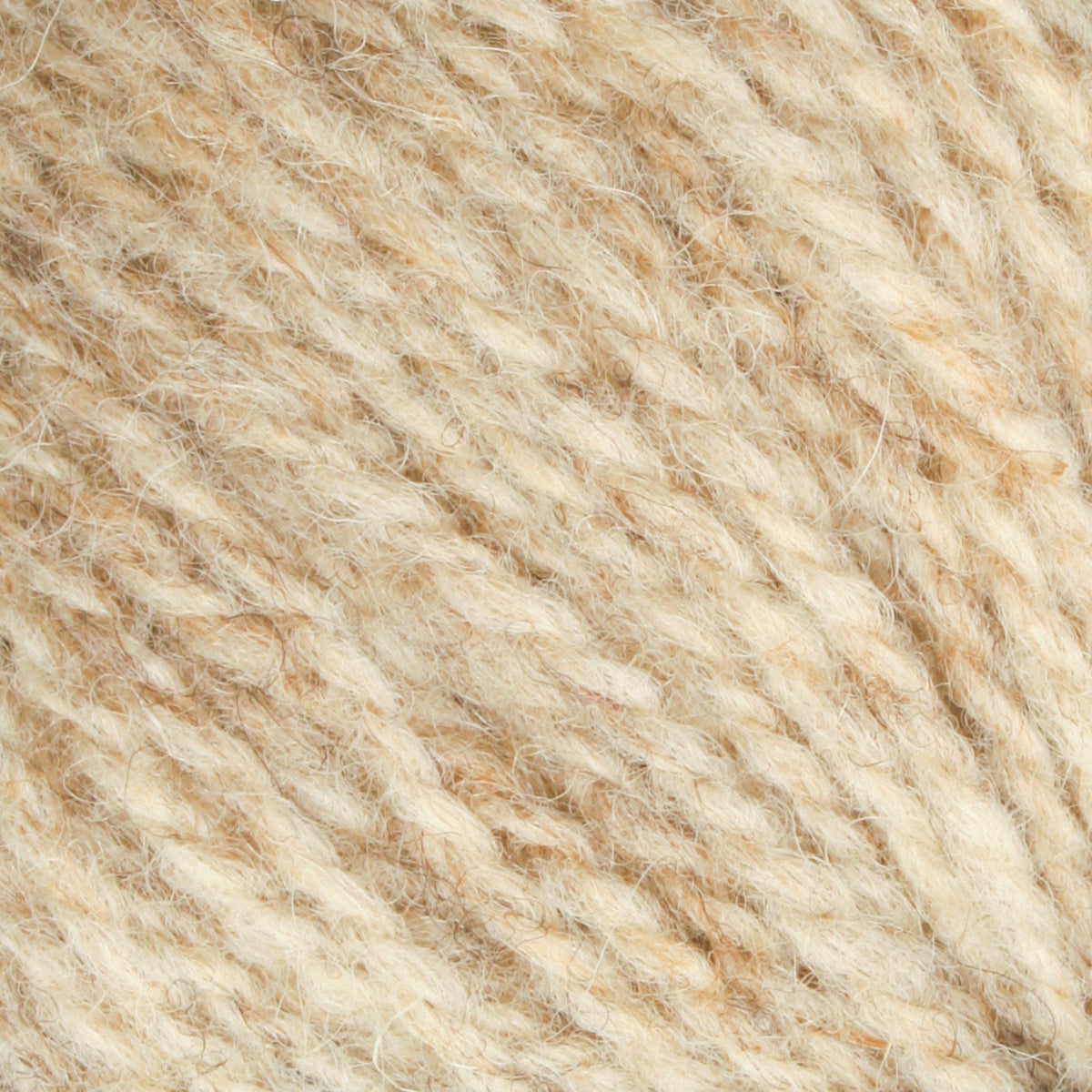 Close-up of Bartlettyarns Maine Wool Yarn (Fisherman 2-Ply) by Bartlettyarns in beige, highlighting its soft, fuzzy texture and intertwined fibers. Diagonal strands create a warm, cozy appearance.