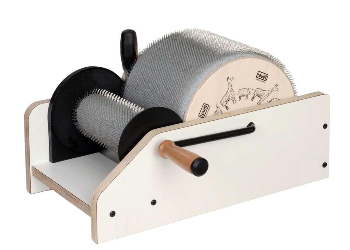 The Louët 8" Classic Drum Carder by Louet Inc. features carding cloth on two large metal drums and a wooden handle, ideal for processing wool. It is adorned with illustrations of animals such as sheep and alpacas on the side.