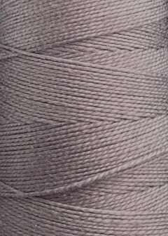 Close-up of a spool of Circulo 5/2 Looma Mercerized Pearl Cotton Yarn | Large Cone in light gray, highlighting the texture and diagonal pattern of its tightly wound fibers.