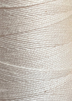 Close-up view of Circulo 5/2 Looma Mercerized Pearl Cotton Yarn | Mini Cone in white, wrapped tightly in even layers to showcase the smooth texture and fine threads of this high-quality material.