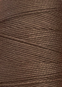 Close-up of a spool of brown 3/2 Looma Circulo Mercerized Pearl Cotton Yarn | Mini Cone, featuring tightly wound fibers with a slightly shiny texture and diagonal pattern. This Oeko-Tex certified yarn from Circulo ensures quality and safety for your textile projects.