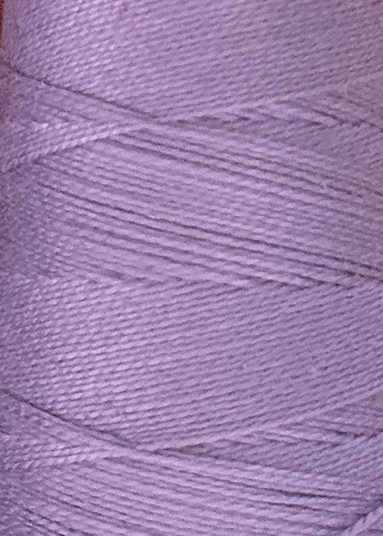 Close-up view of a spool of Circulo 3/2 Looma Mercerized Pearl Cotton Yarn in lavender, highlighting the fine texture and the way the thread is tightly wound in diagonal layers on the large cone.