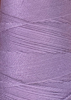 Close-up of a spool of light purple Circulo 10/2 Looma Mercerized Pearl Cotton Yarn | Large Cone, showing the fine details of the threads wound tightly in a diagonal pattern around the spool.