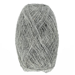 A close-up of a gray ball of Berroco, Inc. Einband Lopi wool, tightly wound with visible texture and ideal for lace knitting, set against a white background.