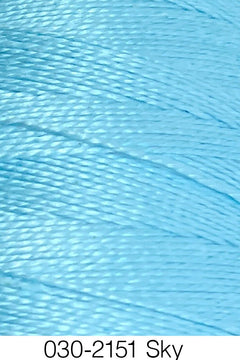 Close-up of shiny sky blue 5/2 Looma Circulo Mercerized Pearl Cotton Yarn, wound in parallel layers and crafted from Oeko-Tex certified cotton for quality and safety. The label below reads 030-2151 Sky by Circulo.