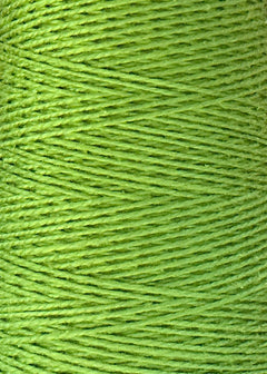 Close-up of tightly wound green threads reveals the rich texture and diagonal pattern of the detailed strands. This is Circulo’s 3/2 Looma Circulo Mercerized Pearl Cotton Yarn | Mini Cone, high-quality cotton weaving yarn that is Oeko-Tex certified for safety and sustainability.