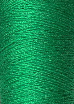 Close-up of tightly wound green 5/2 Looma Circulo Mercerized Pearl Cotton Yarn on a large cone by Circulo, showing the texture and individual fibers.
