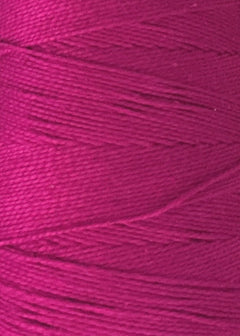 Close-up of a spool of magenta Circulo 5/2 Looma Mercerized Pearl Cotton Yarn | Large Cone, highlighting the fine texture and tightly wound Oeko-Tex certified fibers.