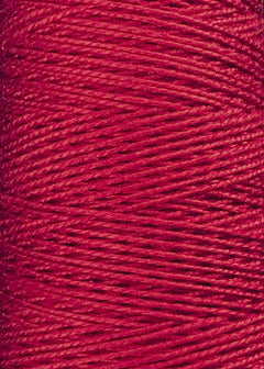 A close-up of the Circulo 3/2 Looma Mercerized Pearl Cotton Yarn (Large Cone) displays the brilliant red fibers, tightly wound with a subtle diagonal pattern and smooth, lustrous texture—perfect for cotton weaving projects and crafted from OEKO-TEX certified materials.
