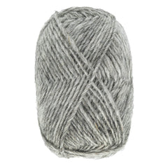 A skein of Berroco, Inc. Léttlopi (Lite Lopi) Icelandic Wool Yarn in light grey, spun for a soft and slightly fuzzy texture, is oval-wound and perfect for cozy colorwork knitting projects.