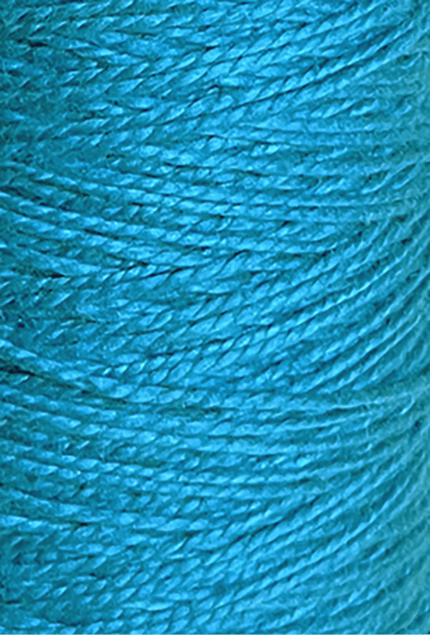 Close-up of tightly wound 3/2 Looma Circulo Mercerized Pearl Cotton Yarn | Mini Cone by Circulo in bright blue, highlighting the texture and individual strands arranged in a diagonal pattern.