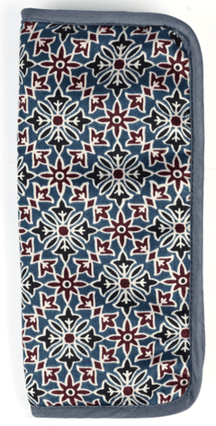 The Lantern Moon Interchangeable Needle Case by Bryson Distributing, Inc. is a handcrafted rectangular IKAT fabric pouch with a blue, white, and maroon geometric floral pattern and dark blue trim—ideal for storing interchangeable needles.