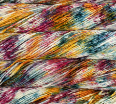 Skeins of Malabrigo Merino Worsted Wool Yarn in a kettle-dyed, variegated pattern of yellow, magenta, and teal against a cream background.