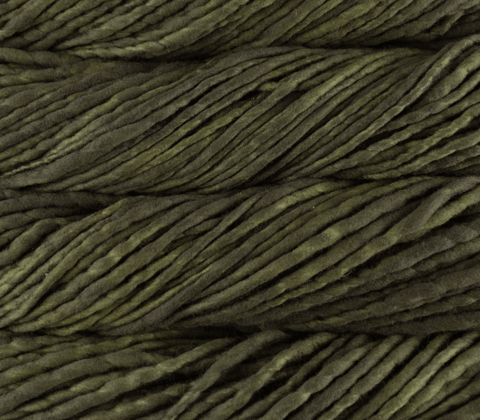 Close-up of thick, super bulky Malabrigo Rasta yarn in variegated shades of dark olive green.