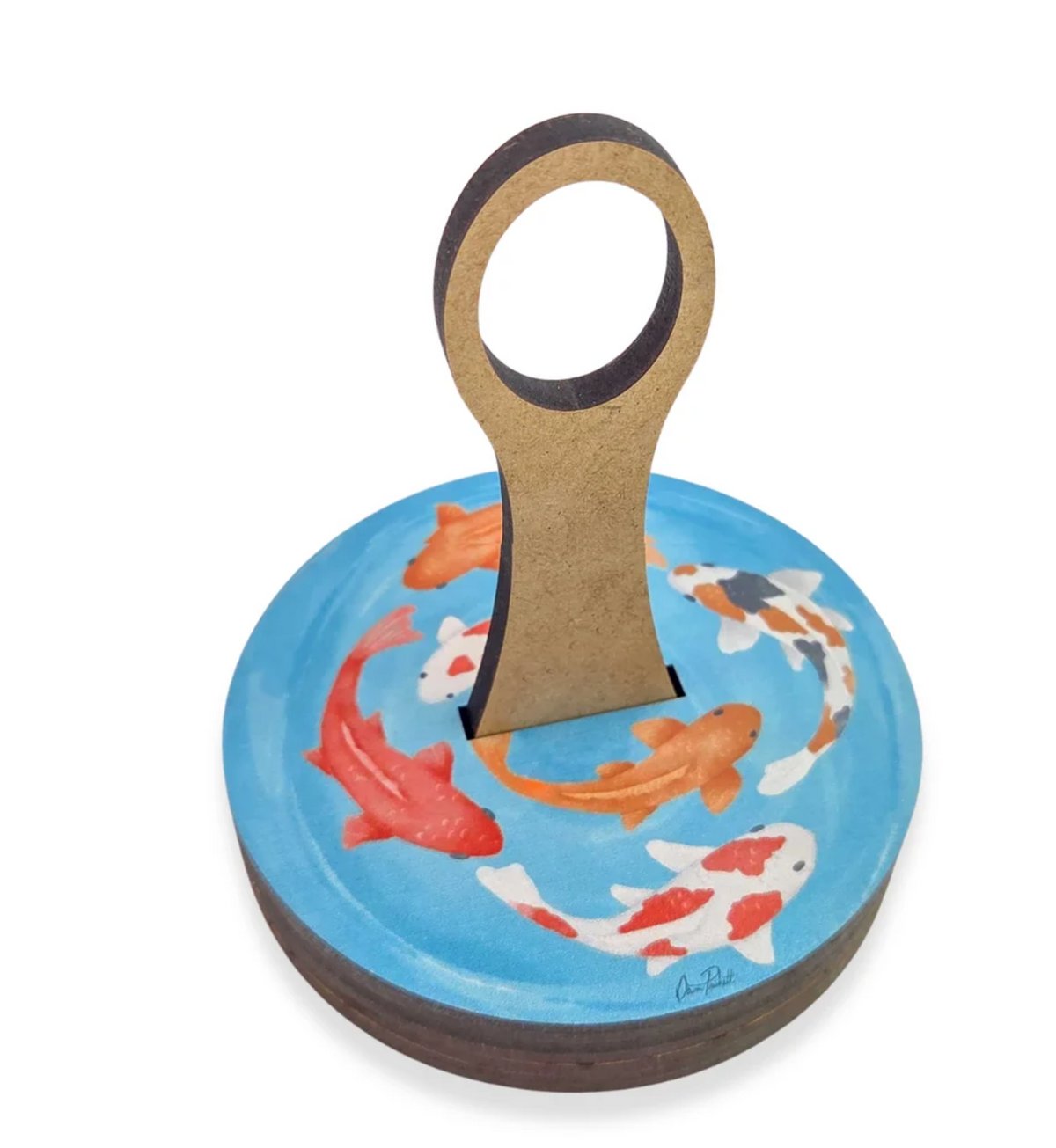 Twice Sheared Sheep Yarn To Go Carousel, a round, wooden portable yarn butler with a vertical handle, featuring a painted blue surface decorated with several orange, white, and black koi fish.
