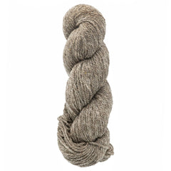A skein of Bartlettyarns Maine Wool Yarn (Fisherman 2-Ply) by Bartlettyarns, a thick heathered light brown worsted weight yarn, is neatly twisted against a white background.