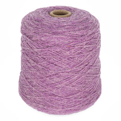 A large cone of Bartlett Maine Wool boasts a tightly wound sport weight texture with a slightly mottled, homespun appearance. Its purple strands from Bartlettyarns stand out beautifully against a plain white background, adding cozy charm.