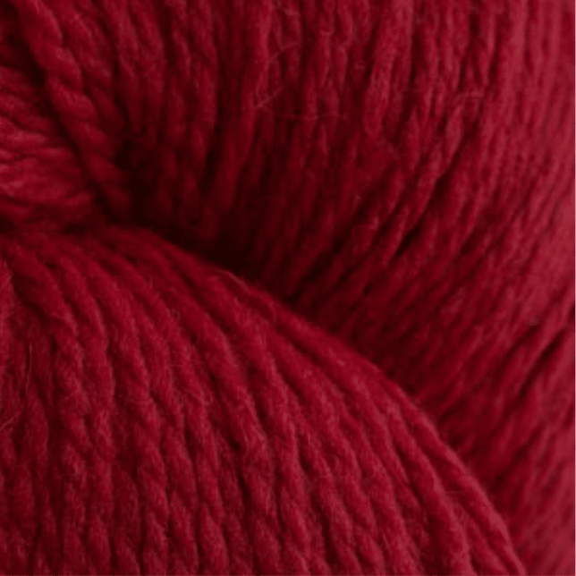 Close-up view of deep red, multi-ply Peruvian Highland wool yarn from Cascade Eco and Cascade Eco Plus Wool Yarn.