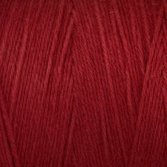Close-up of Great Northern Weaving Cotton Carpet Warp 8/4: deep red 4-ply cotton yarn with soft fibers and loosely twisted strands, highlighting its textured surface and subtle color variations.