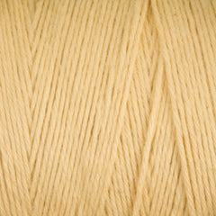 Close-up of cream-colored strands of Cotton Carpet Warp 8/4 by Great Northern Weaving, arranged in parallel to showcase the texture and fibers—an essential weaving supply, perfect for crafting durable rag rugs.