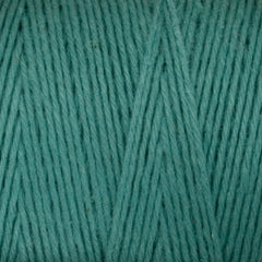 Close-up of Great Northern Weaving Cotton Carpet Warp 8/4 in teal, highlighting its 4-ply cotton texture and tightly wound strands in a crisscross pattern.
