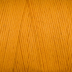 Close-up of tightly wound, smooth orange Cotton Carpet Warp 8/4 from Great Northern Weaving, showing individual fibers and strands running diagonally.