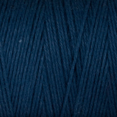 Close-up of Great Northern Weaving's Cotton Carpet Warp 8/4 in dark blue, featuring tightly wound 4-ply cotton fibers and textured strands ideal for rug making.