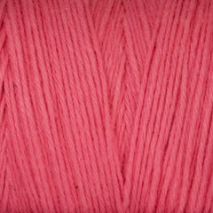 Close-up view of Great Northern Weaving's Cotton Carpet Warp 8/4, featuring soft pink 4-ply cotton yarn with individual strands and fibers tightly wound together in a neat, parallel pattern.