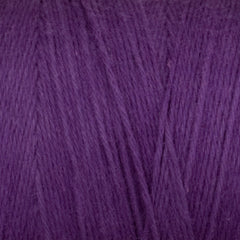 Close-up of Great Northern Weaving Cotton Carpet Warp 8/4 in purple, highlighting the soft texture and fine, intertwined cotton fibers.