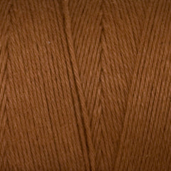 Close-up of Great Northern Weaving’s Cotton Carpet Warp 8/4 highlights the smooth, evenly aligned brown 4-ply cotton fibers, showcasing the soft texture and detail of the tightly wound yarn.