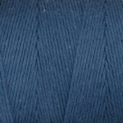 Close-up of Great Northern Weaving Cotton Carpet Warp 8/4 in blue, highlighting tightly wound 4-ply cotton strands and detailed parallel fiber alignment.