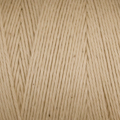 Close-up of Great Northern Weaving Cotton Carpet Warp 8/4 in beige, showing 4-ply cotton yarn wound in parallel layers with visible texture and fibers.