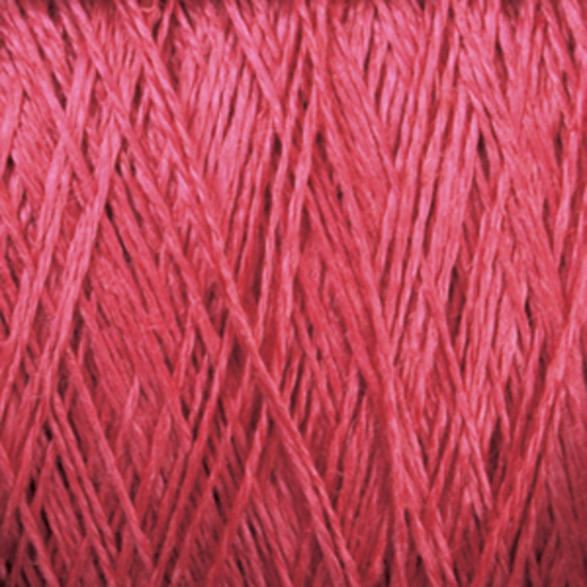 Close-up view of Halcyon Yarn's Newport 16/2 Linen Yarn Mini-cone threads wound in a crisscross pattern, showcasing the texture and sheen of the linen fibers.