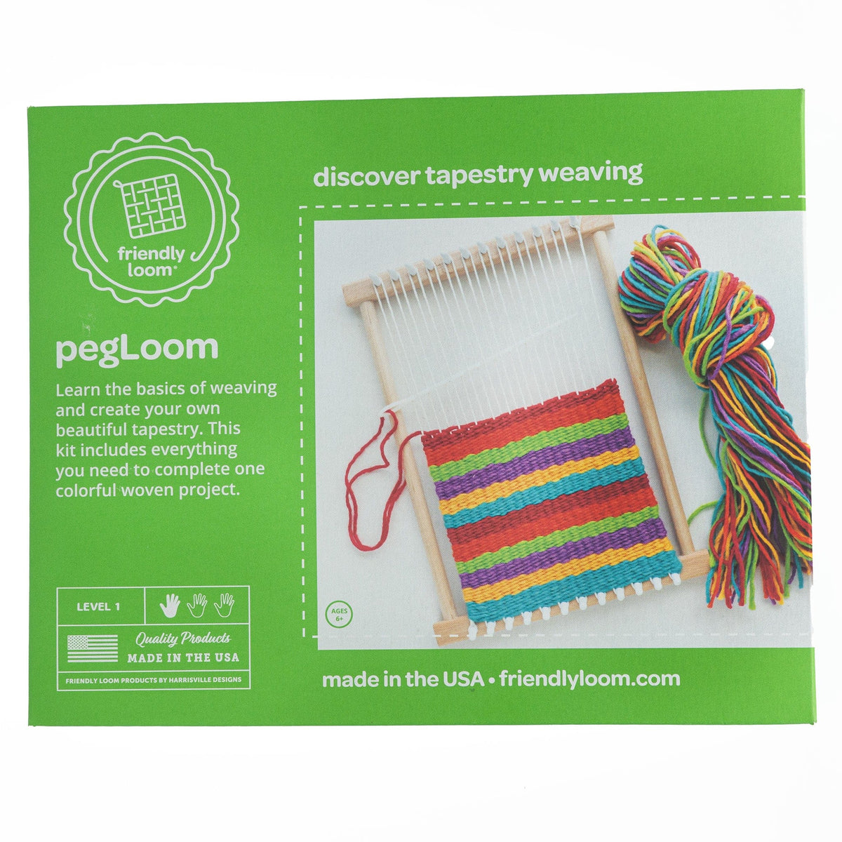 A green box labeled Harrisville Peg Loom Kit with Accessories by Harrisville Designs shows a small wooden loom, colorful woven and rainbow yarn. It's a weaving kit made in the USA for learning basic handcrafted textile skills.