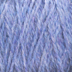 Close-up of soft, fuzzy, blue and purple Harrisville Designs Harrisville Highland - Cones yarn strands intertwined in a textured, woven pattern—perfect for creating rustic sweaters or cozy yarn blankets.